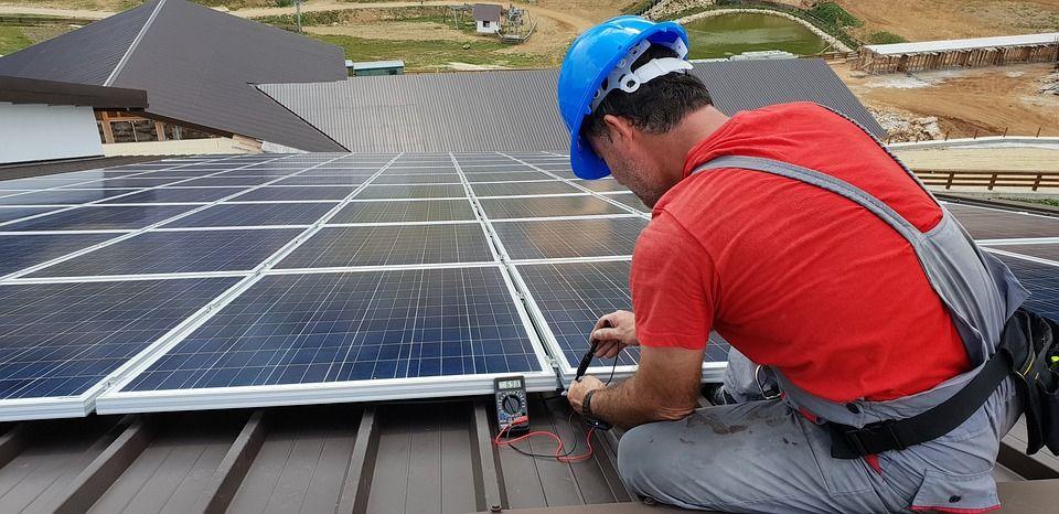 Technician working on solar panel